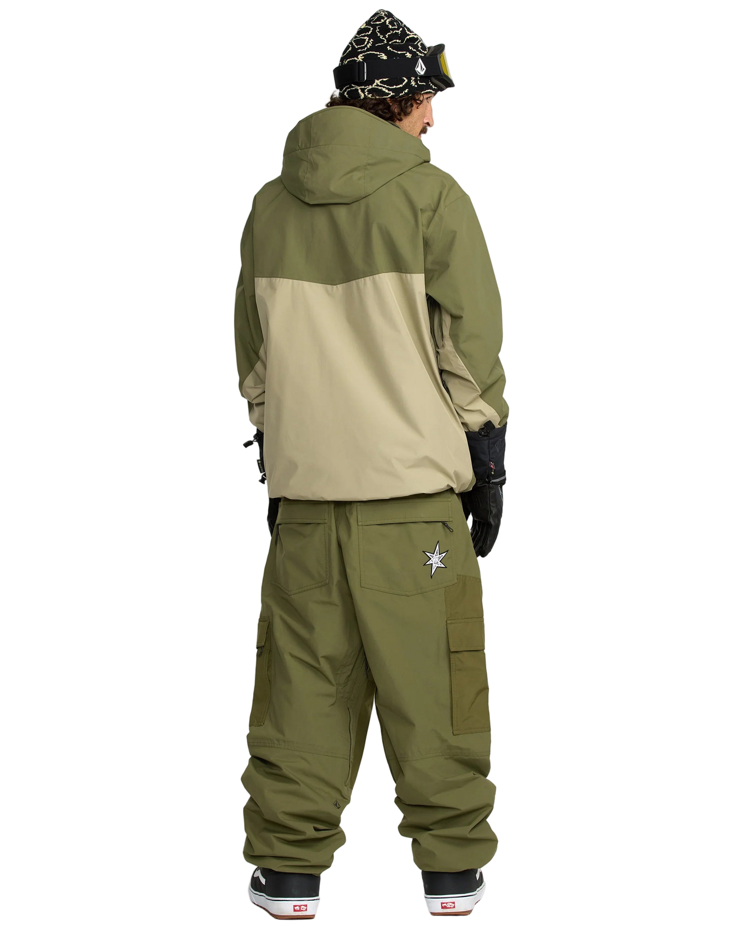Person wearing the Longo Gore Jacket in green and beige jacket with the Longo Gore Pants in Dark Olive on a white background