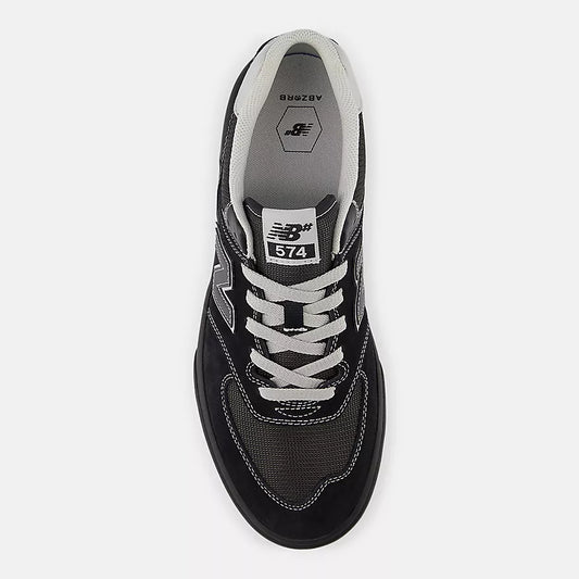 Black sneaker with white laces and New Balance logo on a white background